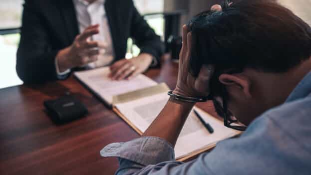 Lawyer talking to a distressed client